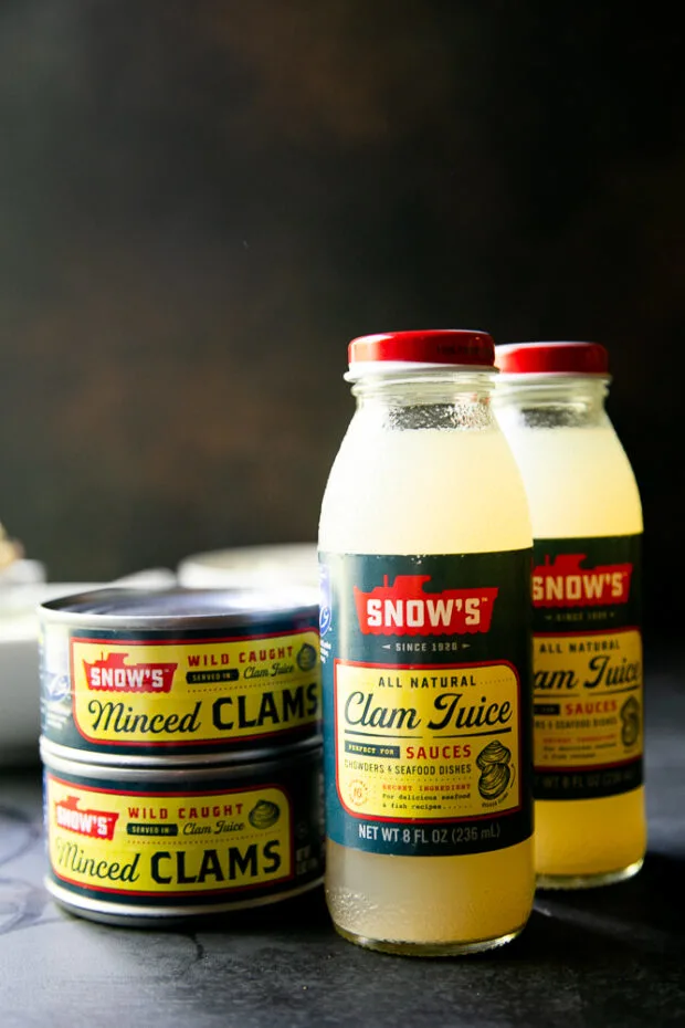 You can find clam juice and canned clams at the grocery store. I like buying minced clams, but you can use chopped clams, too.