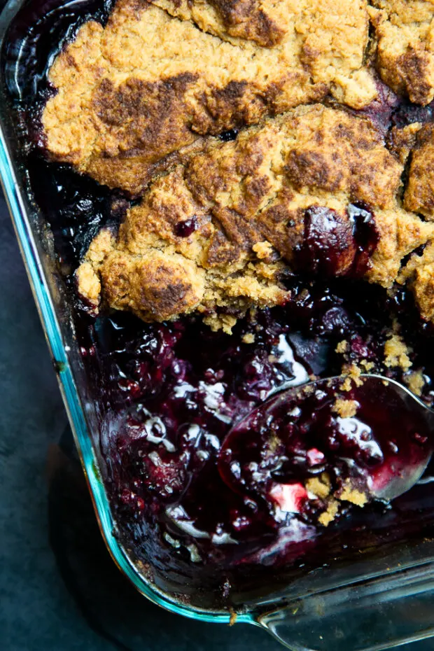 The berry cobbler is finished when the berries are bubbly and the gluten-free topping is cooked all the way through.