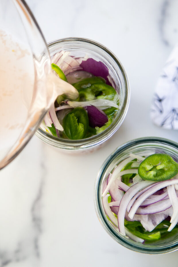 Adding the bring to the sliced red onion and jalapenos.