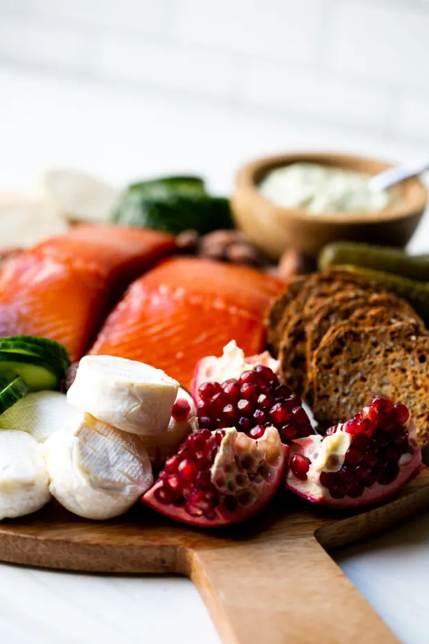 What to serve with smoked salmon? Soft cheese, little toasts, and briny things like dill pickles.