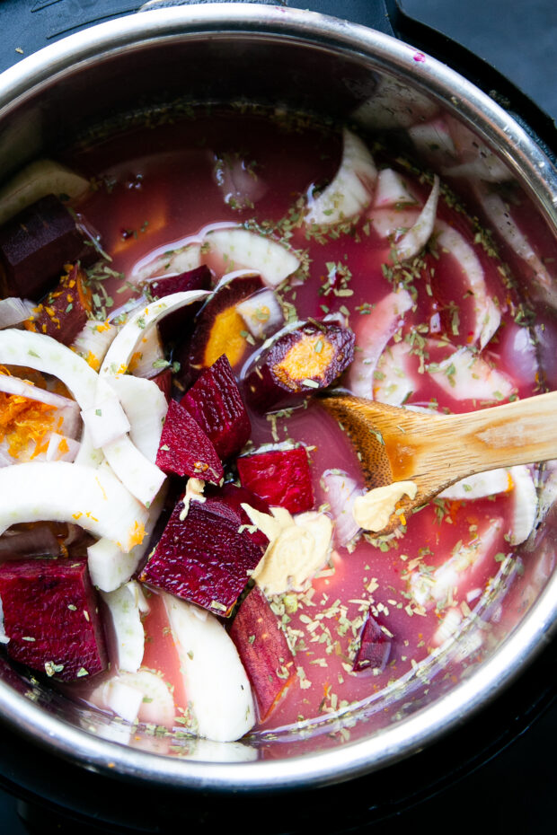 Instant Pot overhead shot with ingredients for pureed beet soup. The ingredients are raw and haven't been cooked yet.