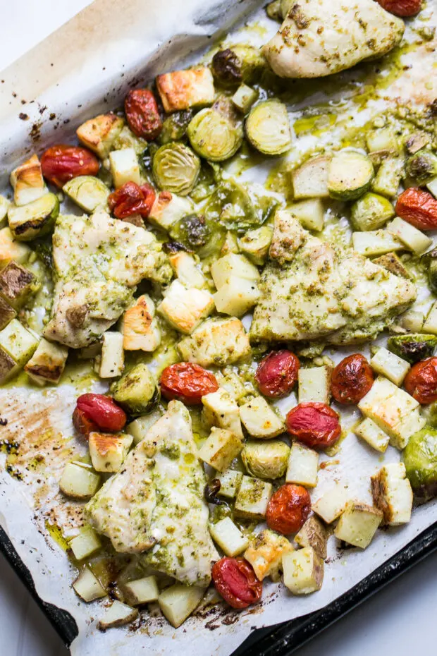 Baked chicken pesto and vegetables fresh from the oven.