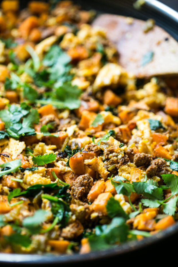 Close up of finished sweet potato hash (paleo) with chorizo and fresh cilantro on top.