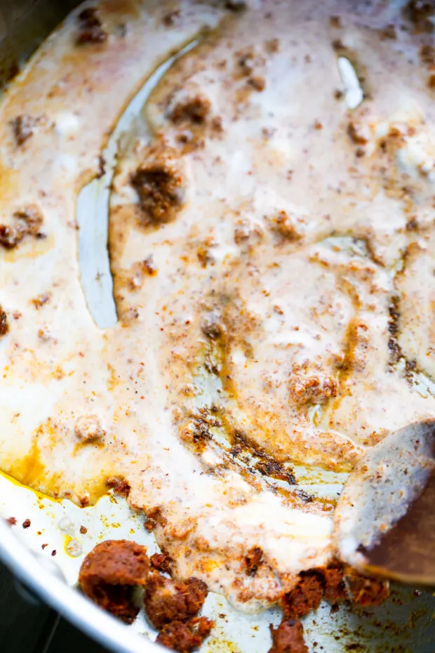 View from inside the skillet where the curry paste and coconut milk are sizzling together.