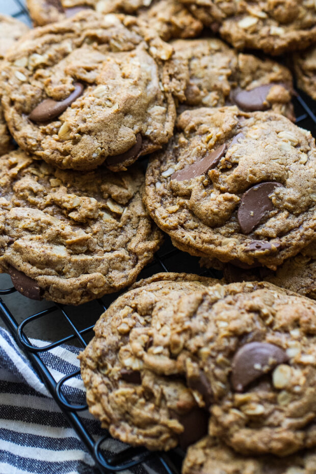 Gluten-Free Peanut Butter Oatmeal  Chocolate Cookies stacked on a cooling rack.