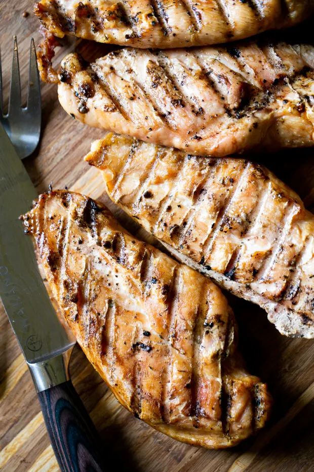 Smoked Chicken Breasts fresh off the grill with grill marks.