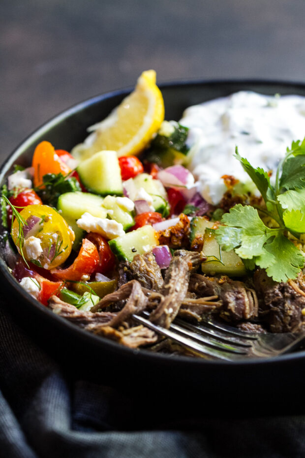 Another shot of the shredded Greek-style beef served with cucumber tomato salad, cucumber yogurt sauce, and rice.