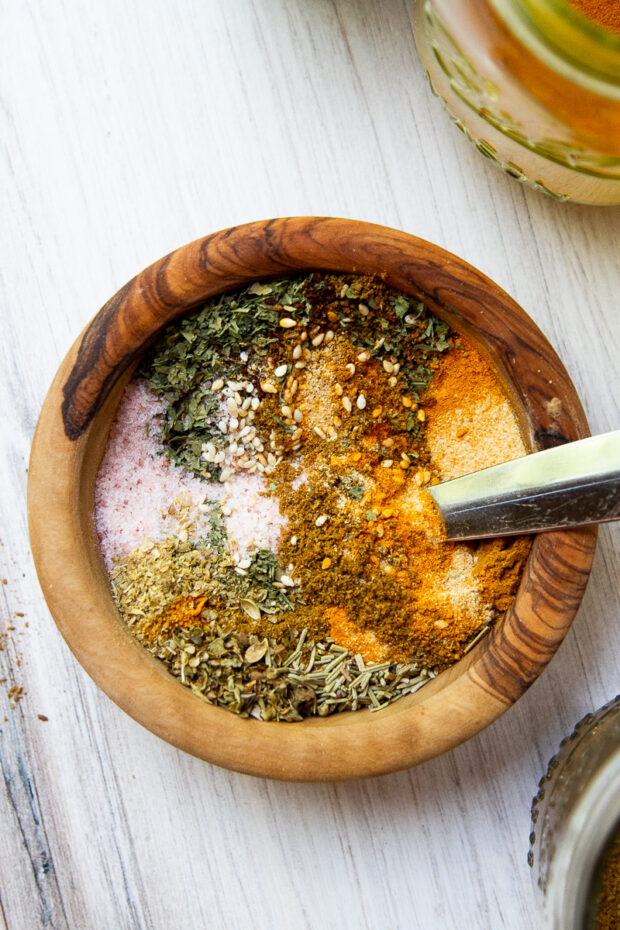 The same wooden bowl with the spices partially blended.