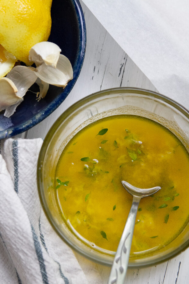 Melted butter mixed with grated garlic, lemon juice, and fresh thyme.