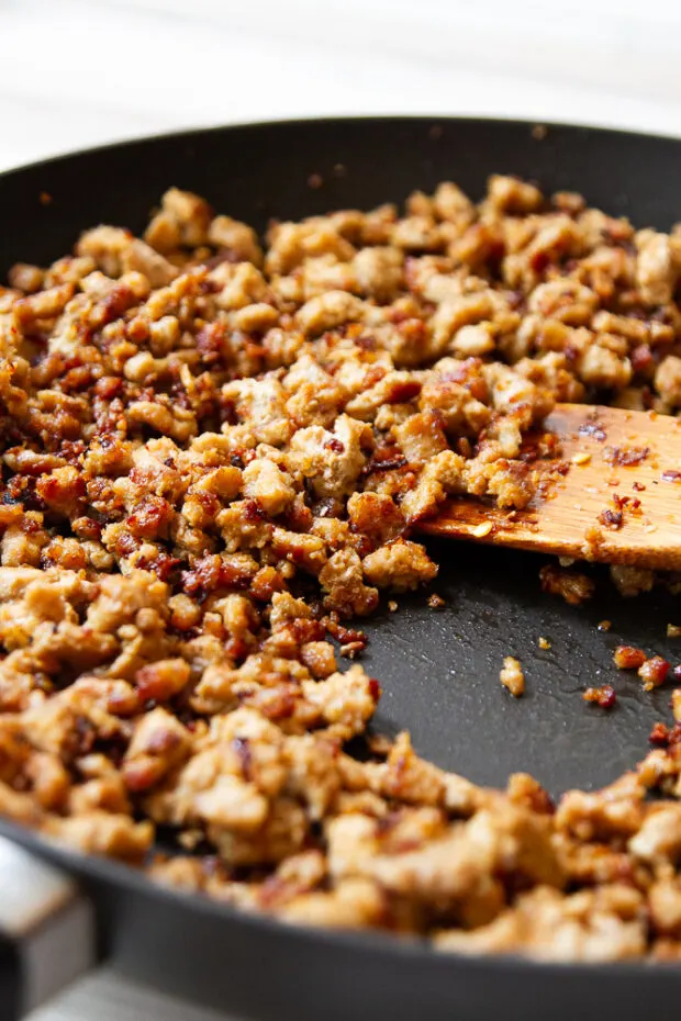 Spicy ground turkey cooked in a skillet.
