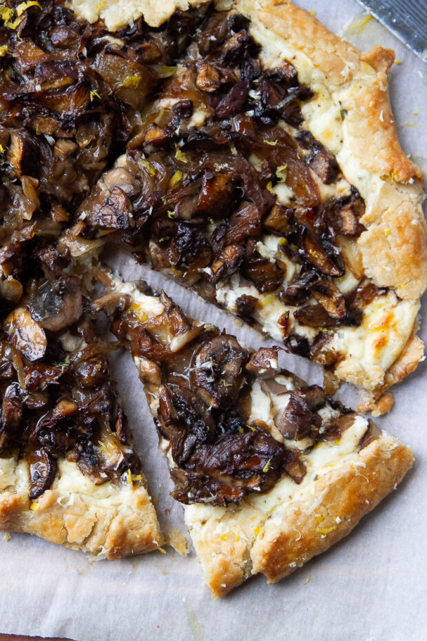 Baked mushroom galette sliced into wedges.