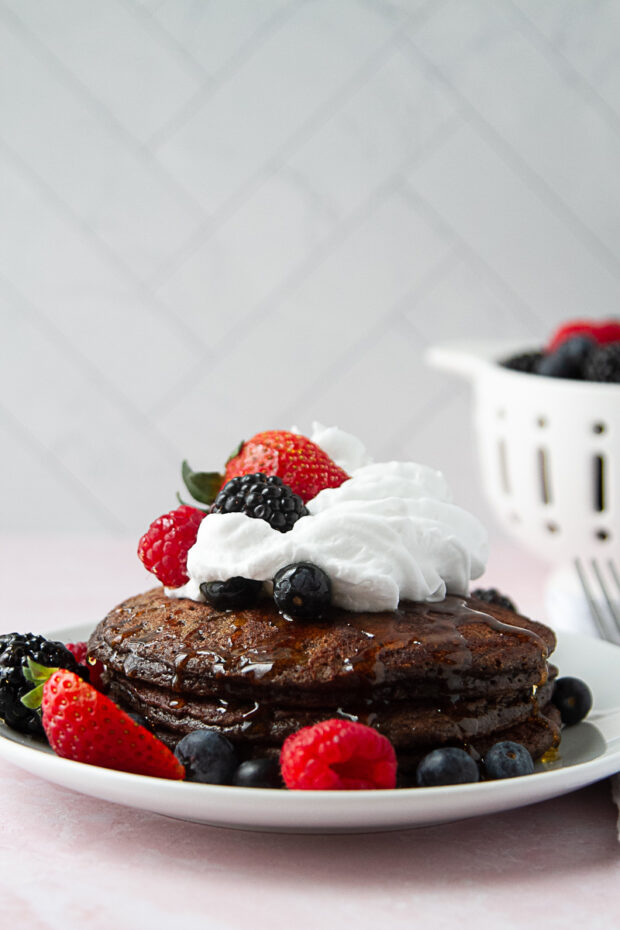 Now there's coconut whipped cream added to the pancakes with the fresh berries and honey.