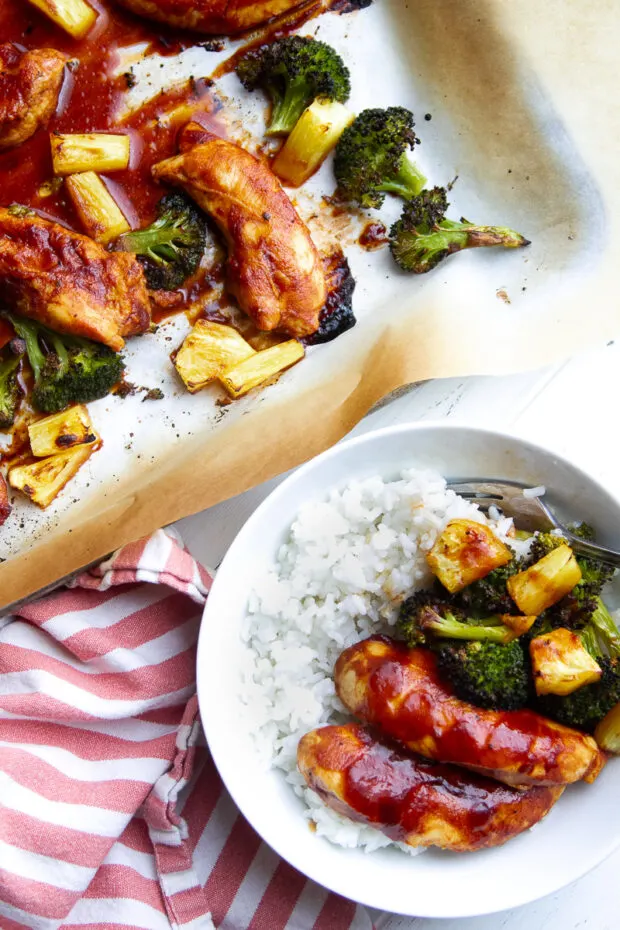 A bowl with white rice, Hawaiian BBQ Chicken & Roasted Broccoli & Pineapple.