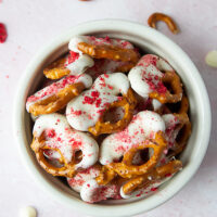 Bowl of strawberry white chocolate dipped pretzels