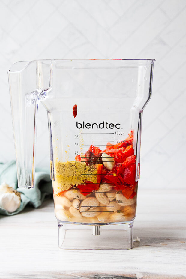 Ingredients for roasted red pepper sauce in a blender pitcher -- before blending.