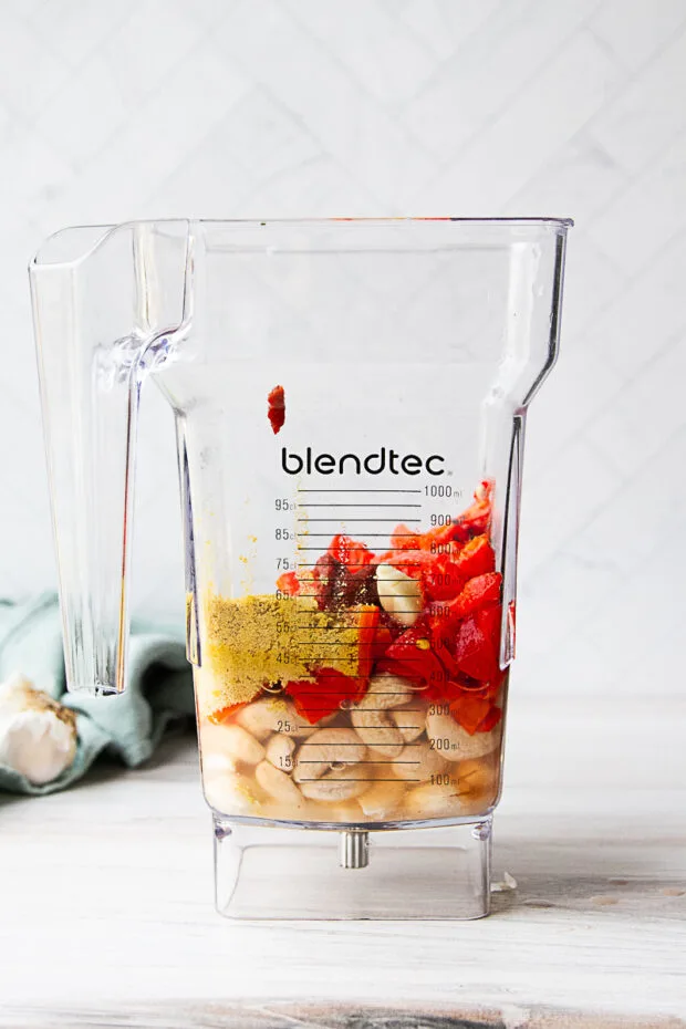 Ingredients for roasted red pepper sauce in a blender pitcher -- before blending.