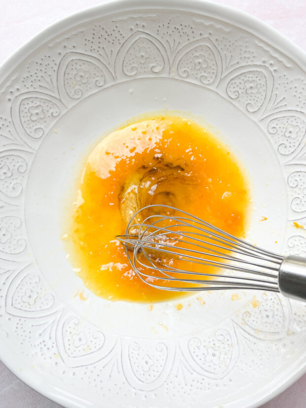 Orange Vanilla Dressing for berry salad whisked together in a serving bowl.
