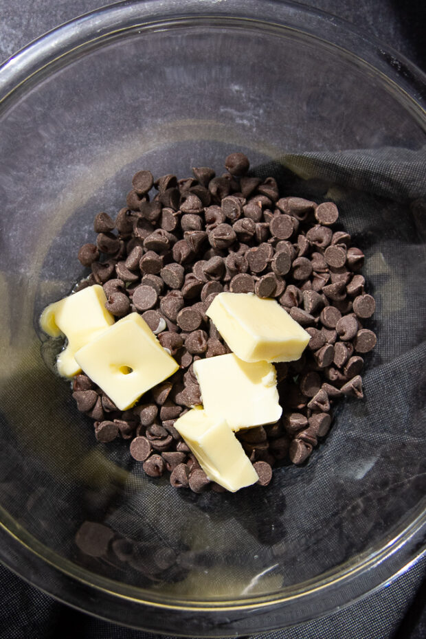 Bowl with chocolate chips and butter.