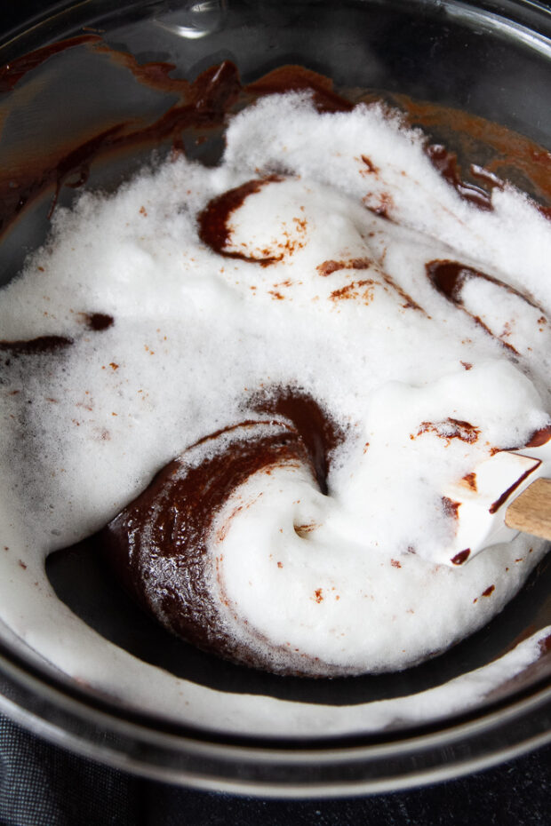 Egg whites beginning to be blended into the melted chocolate mixture.