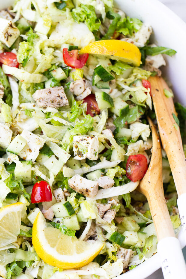 Finished grilled chicken salad with feta in a serving bowl.