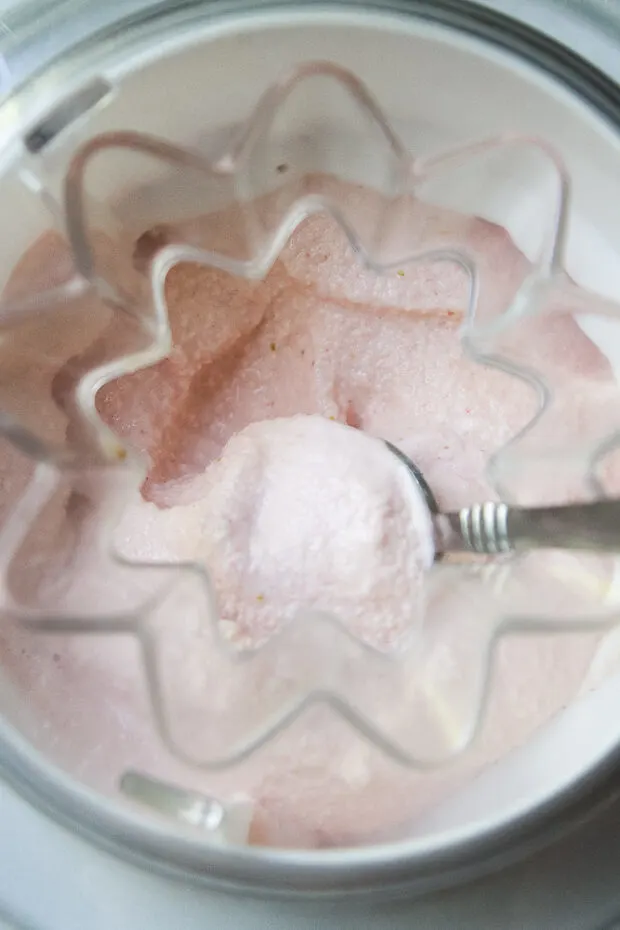 Frozen Greek yogurt has been frozen -- view inside the ice cream machine.