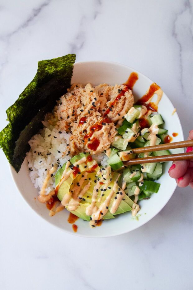 The Spicy Shrimp Bowl variation of this recipe, garnished with sriracha mayo, straight sriracha sauce, and some roasted seaweed snacks.