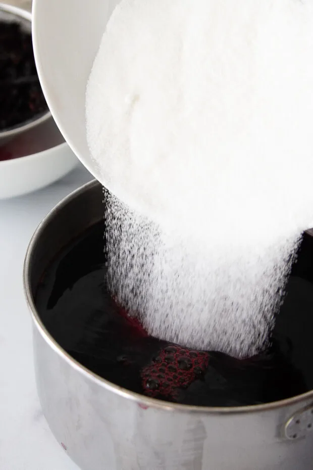 Sugar poured into the concentrated hibiscus tea.