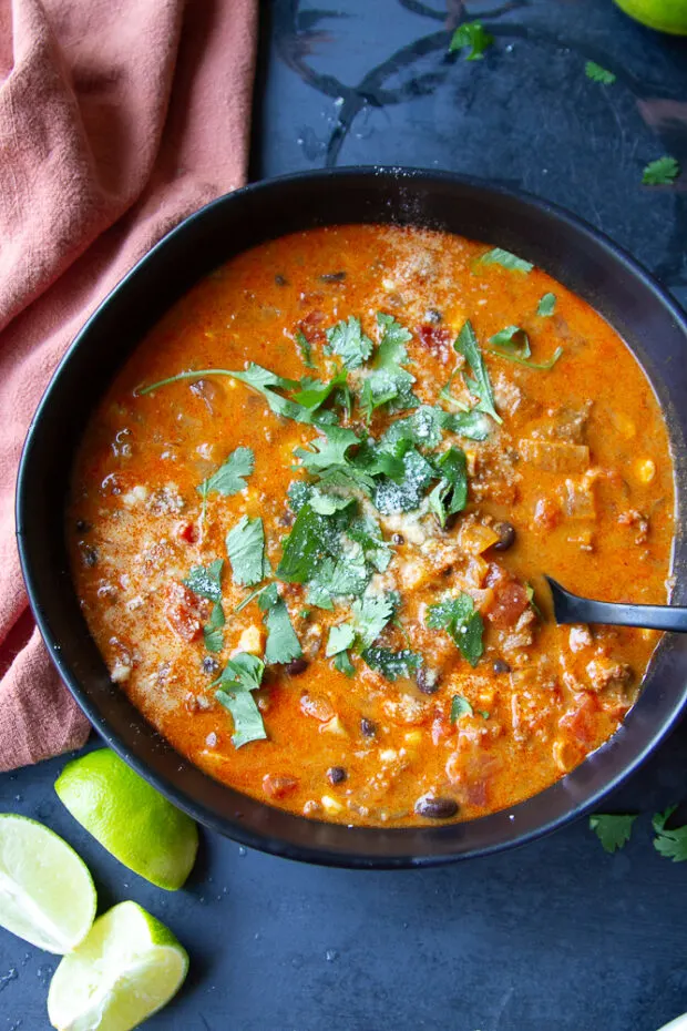 Black bowl of pumpkin chorizo chili