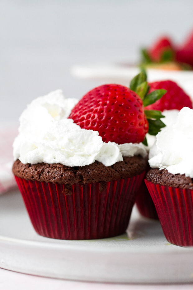 Another shot of the brownie version of the flourless chocolate cakes with whipped cream and strawberries.