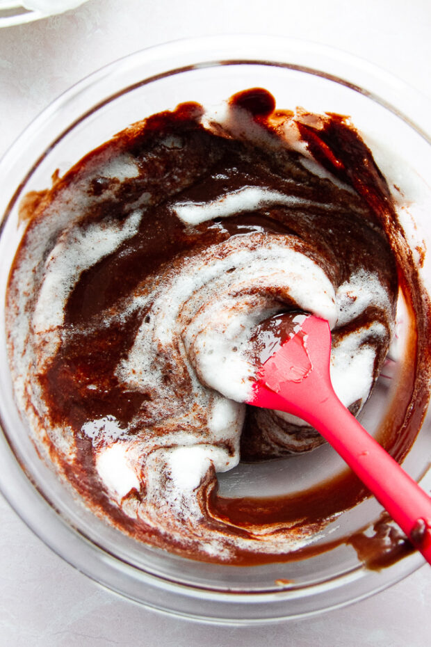 Egg whites partially folded into the melted chocolate mixture.