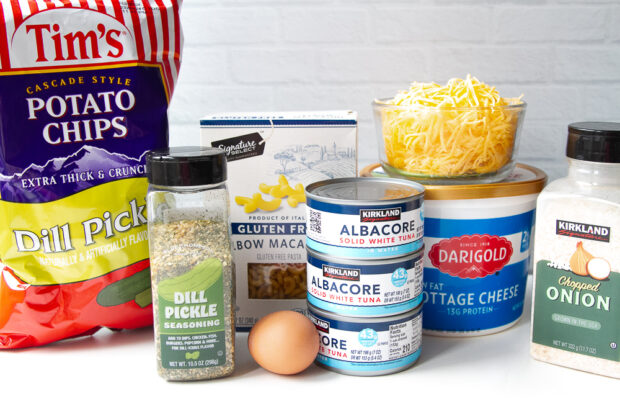 Ingredients for tuna noodle casserole. (almost all of them) Tuna, cottage cheese, dried minced onion, cheddar cheese, gluten free pasta, dill pickle seasoning, dill pickle potato chips.