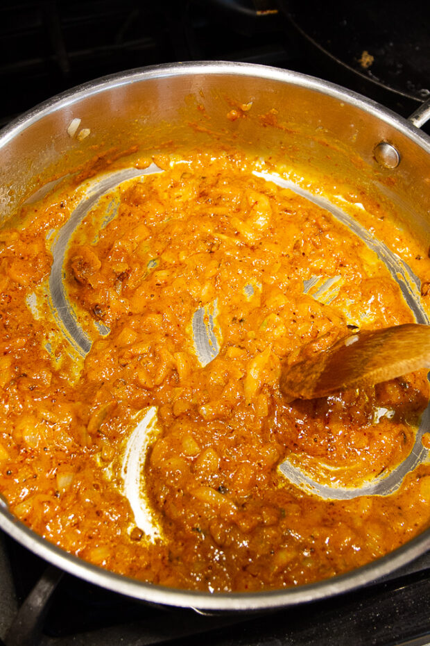 Thickened curry sauce in a skillet.