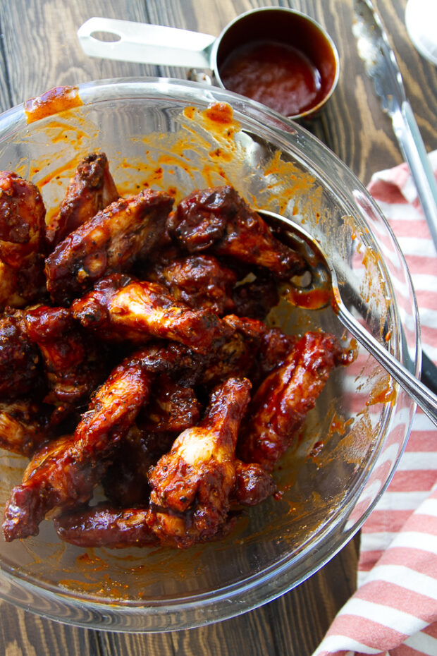 Freshly smoked wings that have been tossed in a little BBQ sauce.