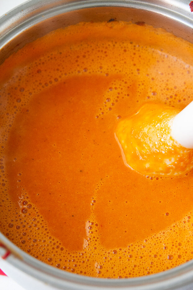 Blended Roasted Red Pepper soup using an immersion blender.