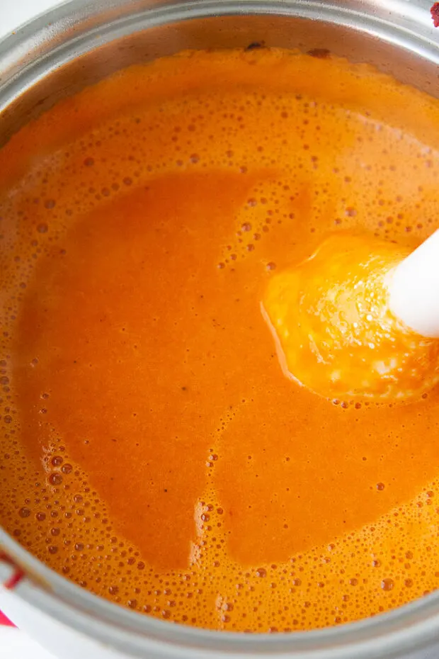 Blended Roasted Red Pepper soup using an immersion blender.