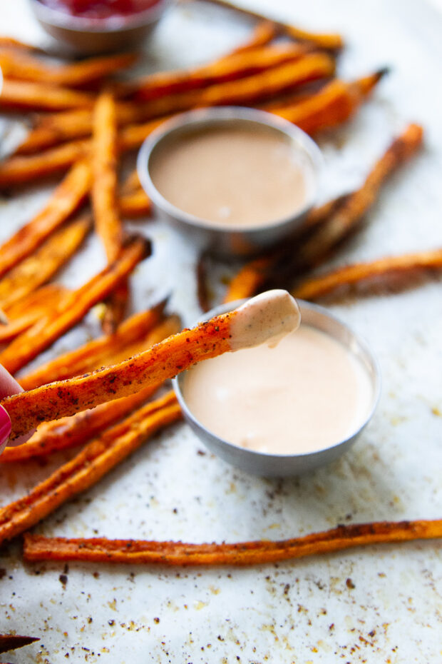 Sweet potato fry dipped in sriracha mayo.