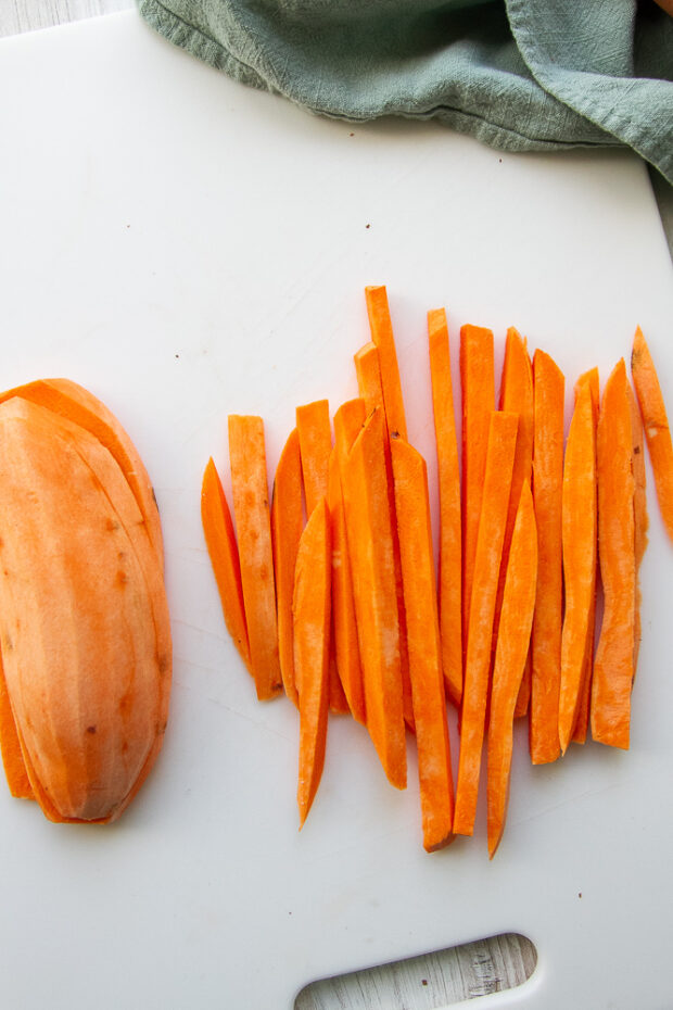 Sweet potato planks cut into thin fries.