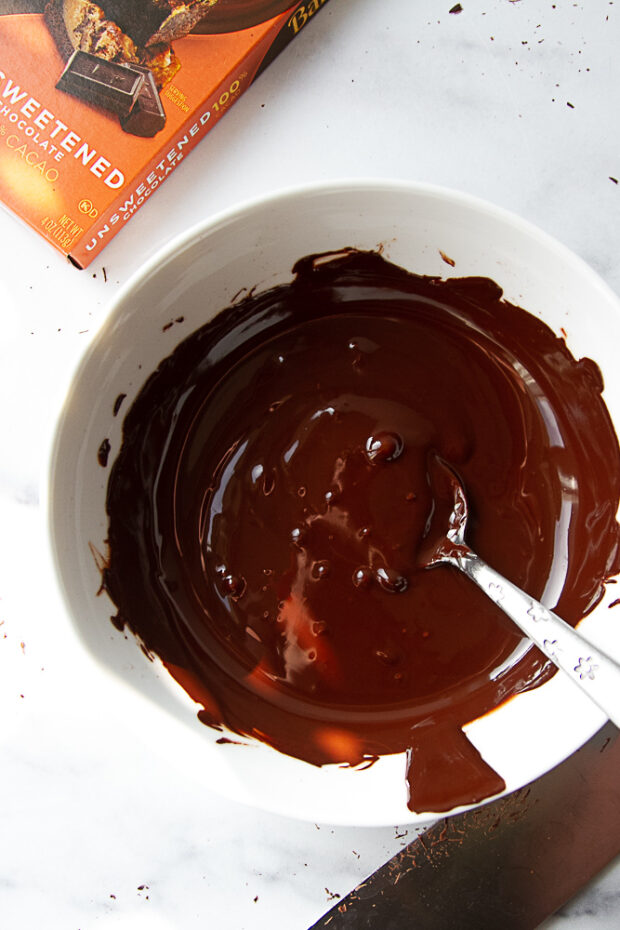 Baking chocolate melted in a bowl.