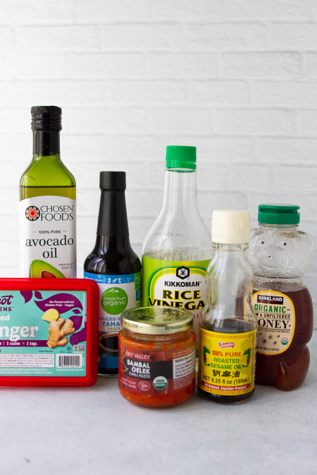 Ingredients for the teriyaki sauce: tamari soy sauce, rice vinegar, sesame oil, honey, sambal oelek, and ginger.
