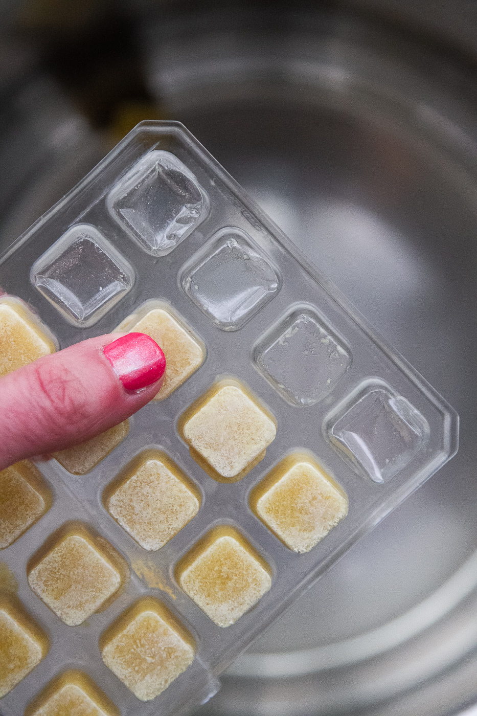 View of the frozen ginger cubes being popped out.