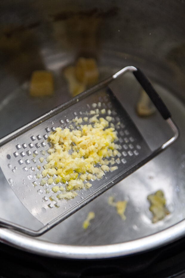 Fresh garlic being microplaned.