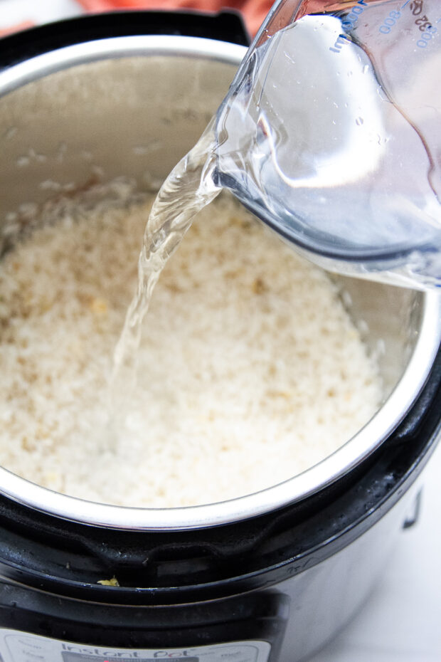 Water poured into the Instant Pot with the rice.