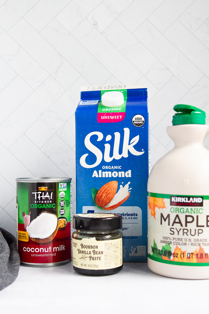 Ingredients for dairy free coffee creamer: full-fat coconut milk, almond milk, maple syrup, and vanilla bean paste.