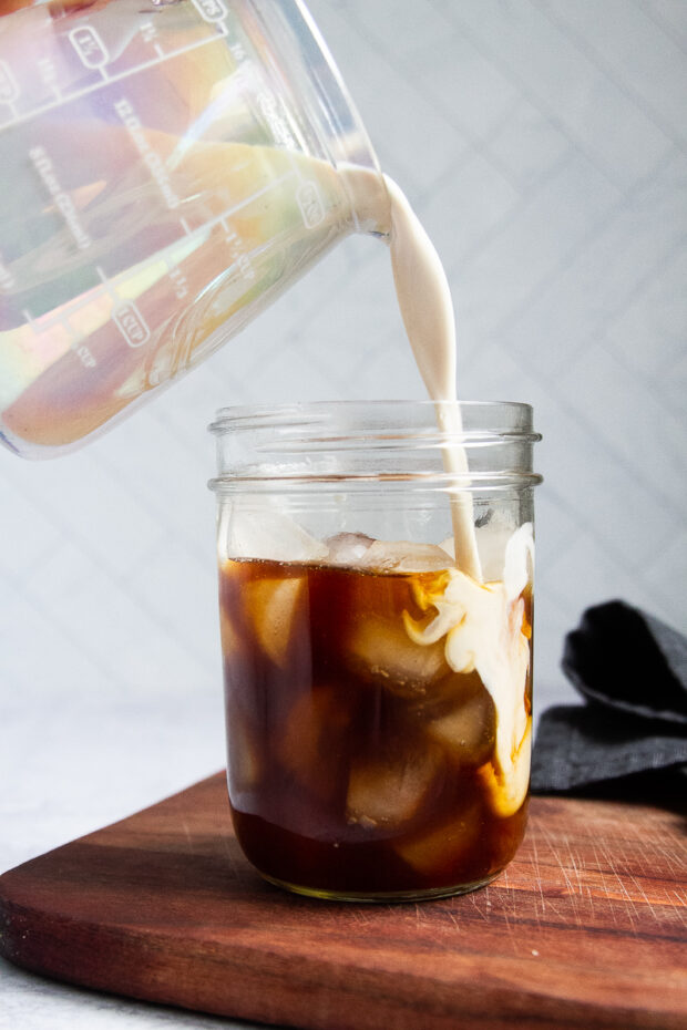 creamer poured into coffee