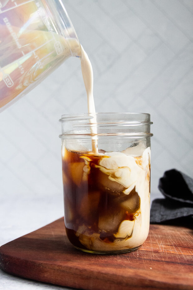 creamer poured into coffee