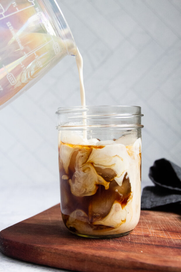 creamer poured into coffee