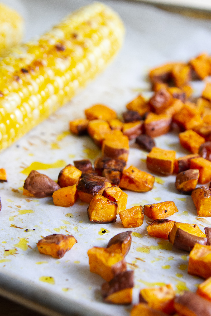 Roasted corn and sweet potatoes after being in the oven.
